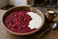 Red berry pudding with cream