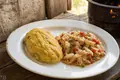 Fungie with saltfish buljolde