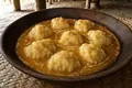Tongan coconut-syrup dumpling pudding