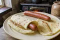 Norwegian hot dog in potato flatbread