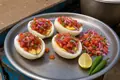 Split eggs with kachumbari